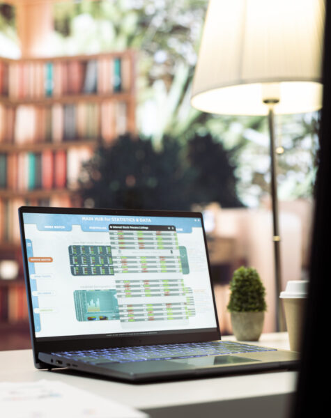 Empty modern office of a business entrepreneur with laptop Empty modern office of a business entrepreneur with laptop running financial analysis plans for startup investment and expansion. Remote work on infographics and bank account analytics.
