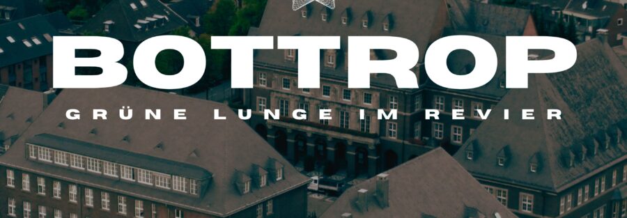 Luftaufnahme von Bottrop mit historischen Gebäuden und Grünflächen.